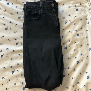 black jeans w holes in each knee